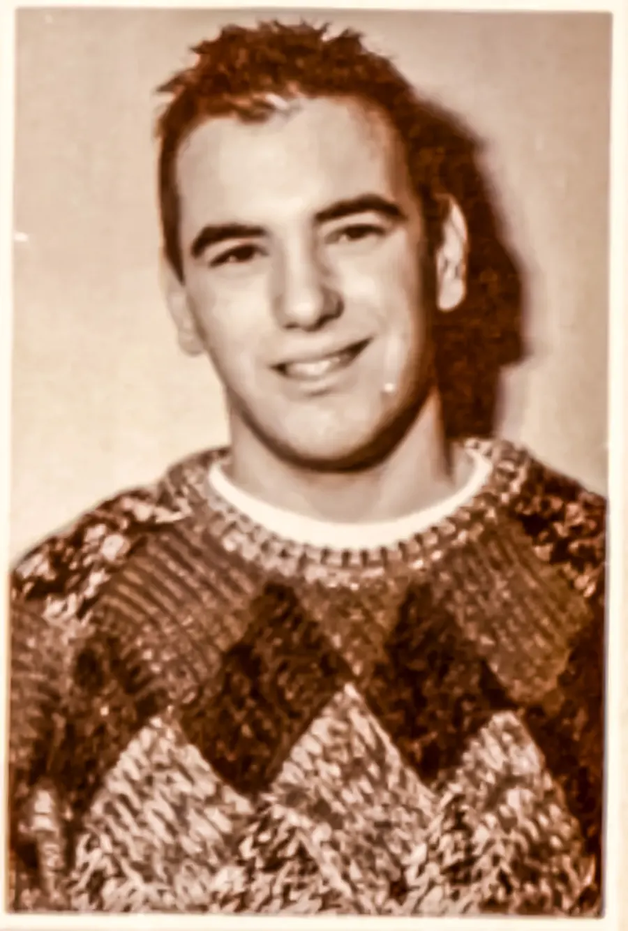 Dana White with hair wearing a sweater