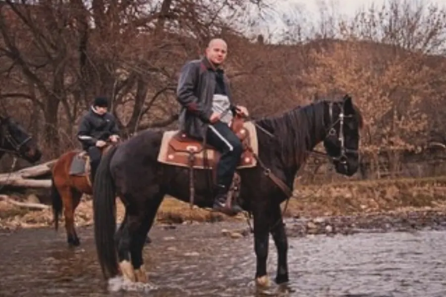 Fedor Emelianenko riding a horse